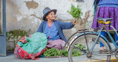 A vendor selling vegetables in Peru