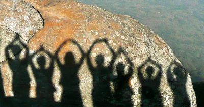 Silhouettes on a rock