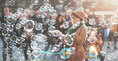 woman standing in sea of bubbles