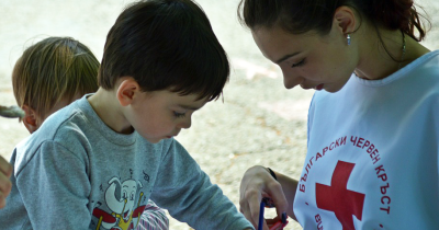 Medical volunteer with children