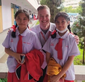 a teacher with two students