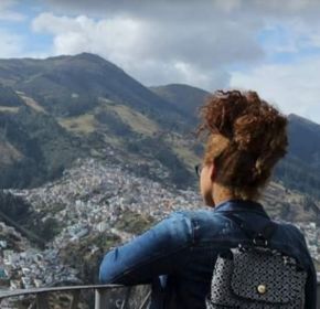 student looking at city and mountain view in Ecuador