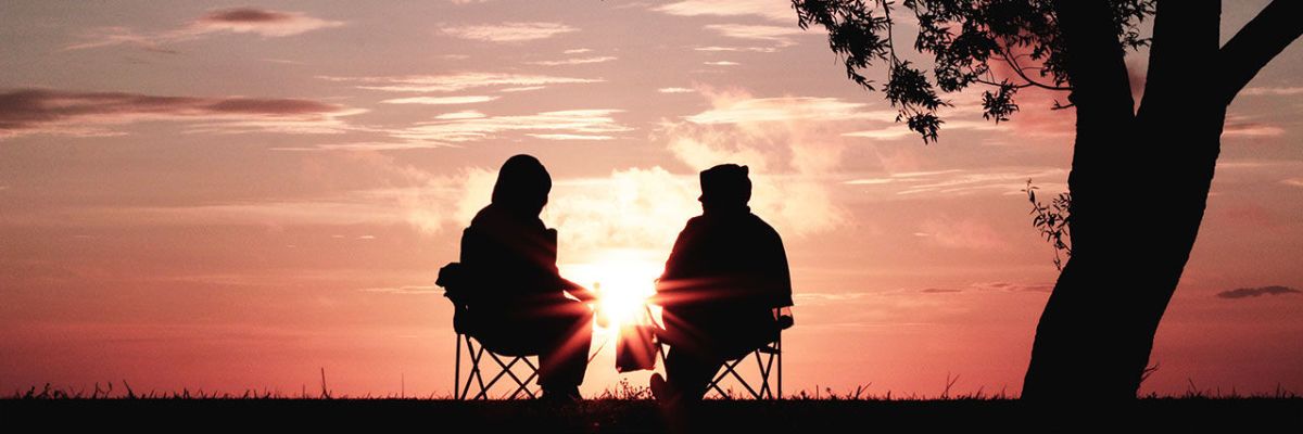 Two people watching sundown