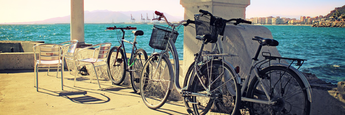 Biking along the Malaga harbor in Spain