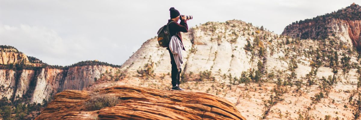 A photographer on top of a mountain