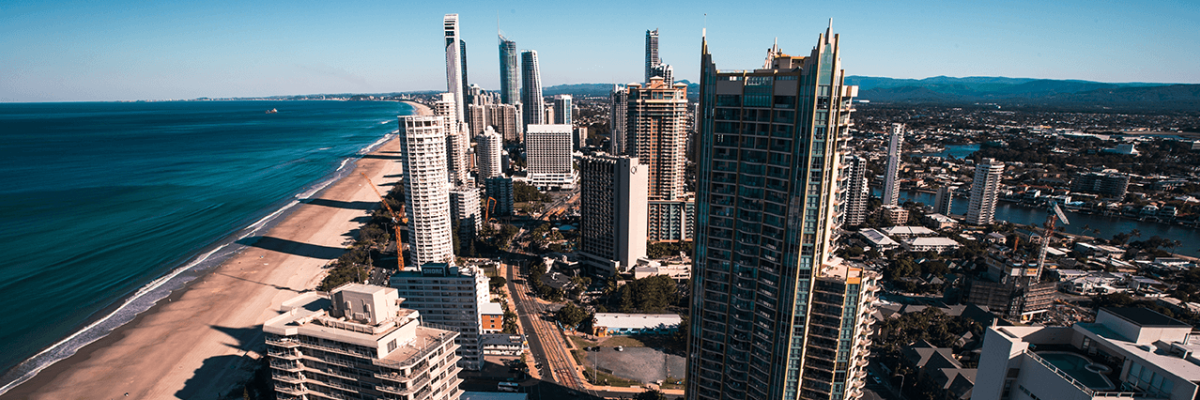 Gold Coast, Australia, city rising up next to the beach and ocean in the afternoon