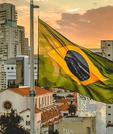 flag of Brazil near high-rise buildings