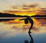 teen in yoga pose at sunset on salt flat in Bolivia