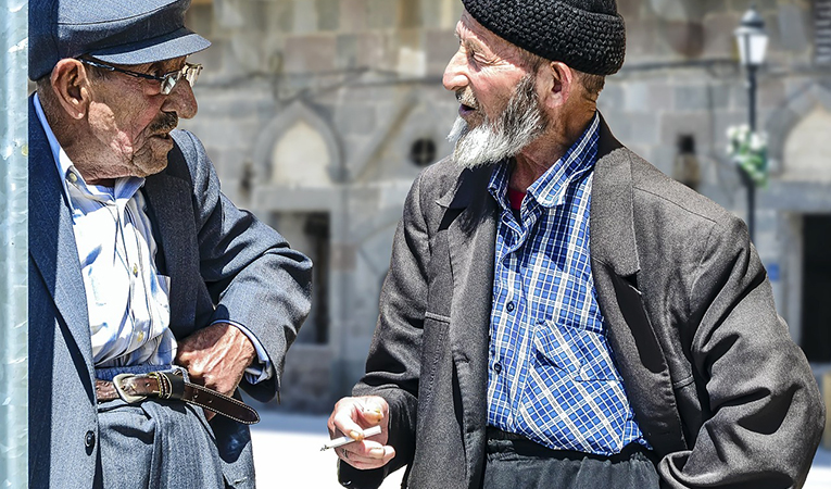 Older men speaking to each other