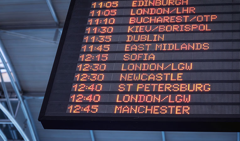 departures board with international cities