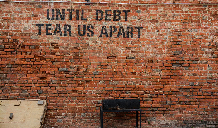 Sign that says Until Debt Tear Us Apart