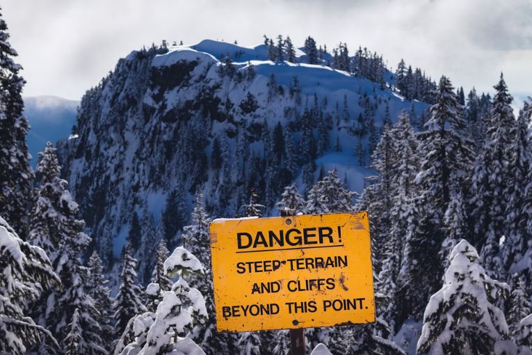 danger sign on a snowy mountain