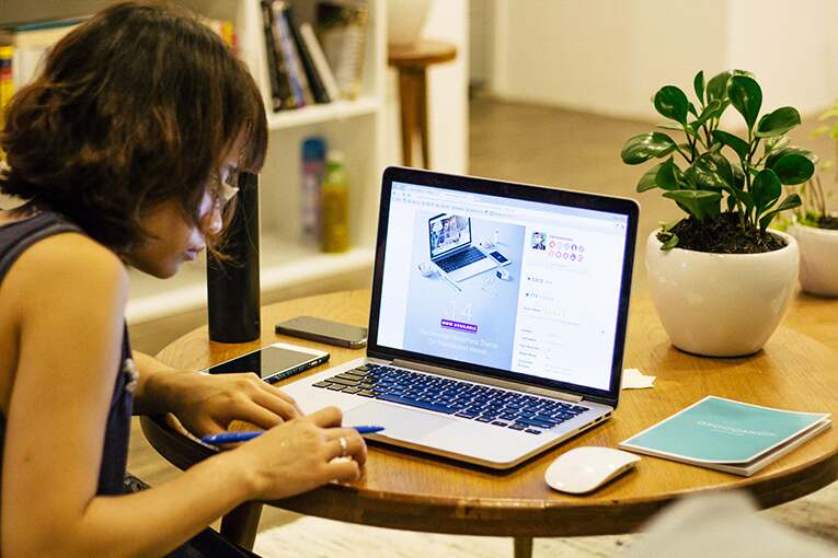 A student working on her laptop