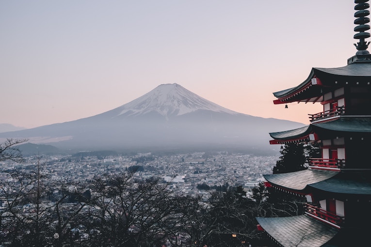 pagoda on hilltop facing Mt. Fuji