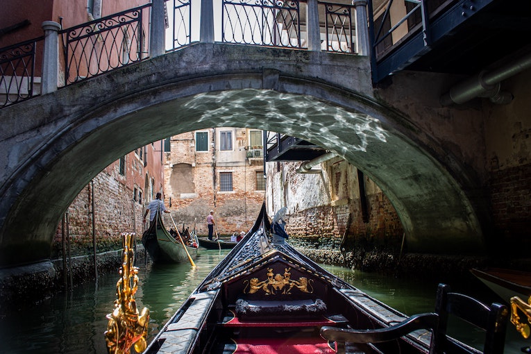 first person perspective of a gondola ride in venice