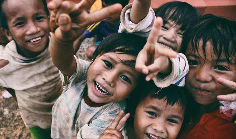 kids smiling at camera in vietnam