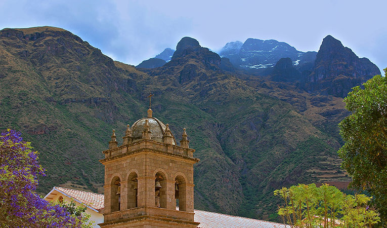 Church steeple with mountains in background, Peru