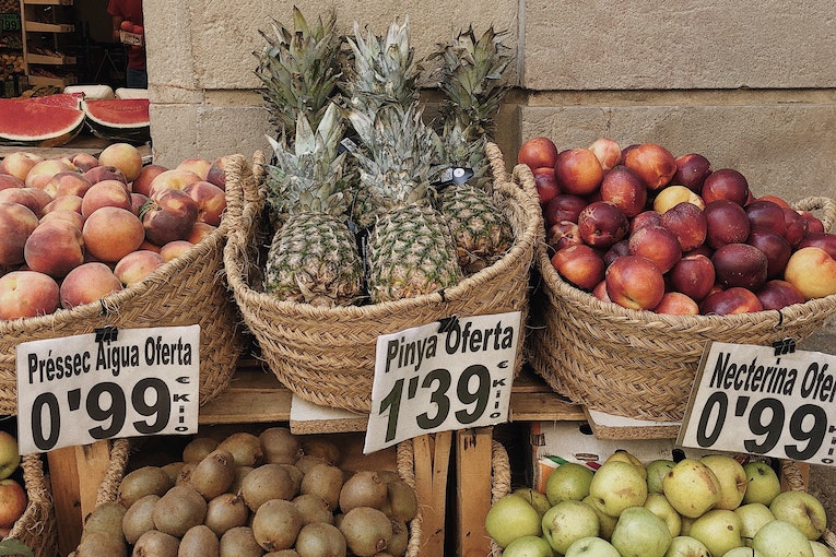 baskets of fruit labeled in catalan