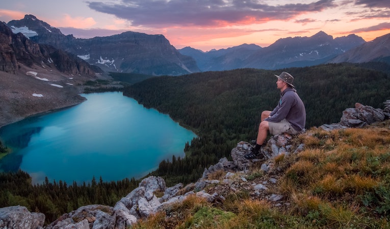 person overlooking banff national park at sunset