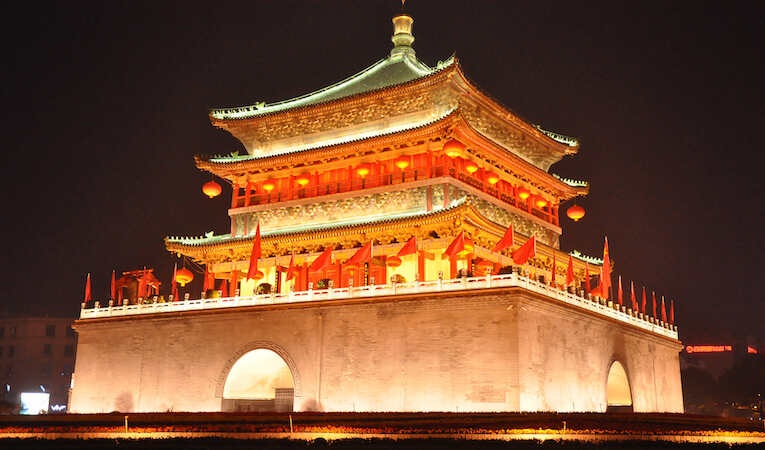 a lit up temple in china at night