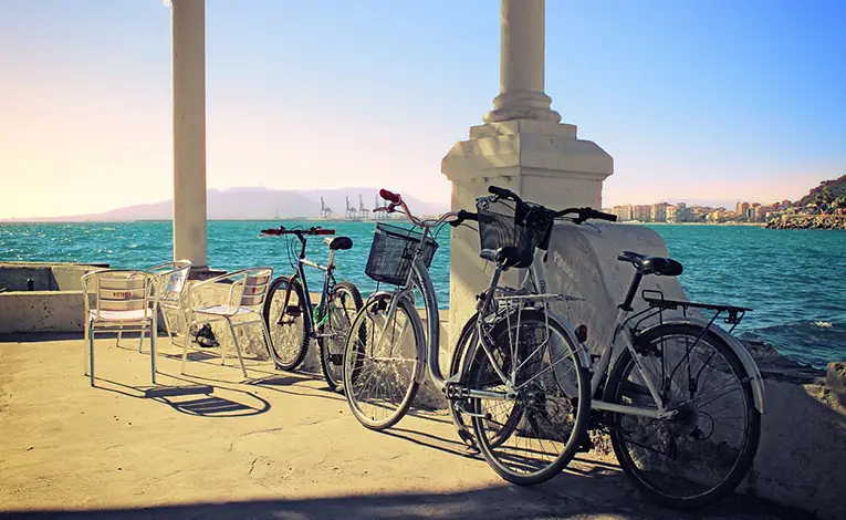 Biking along the Malaga harbor in Spain