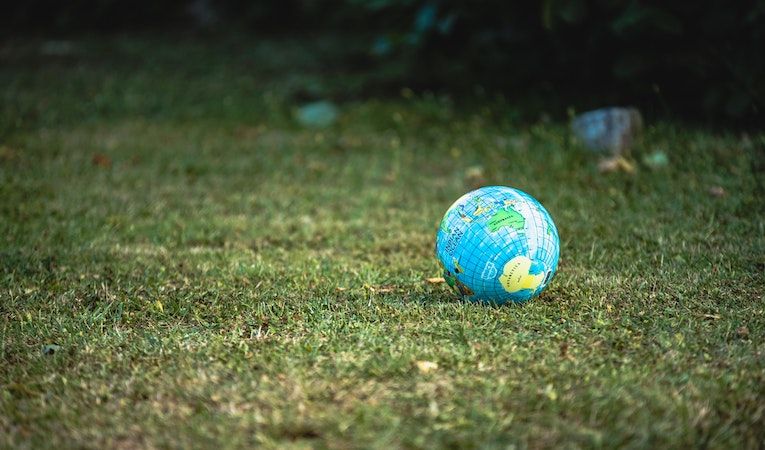 globe on a green lawn