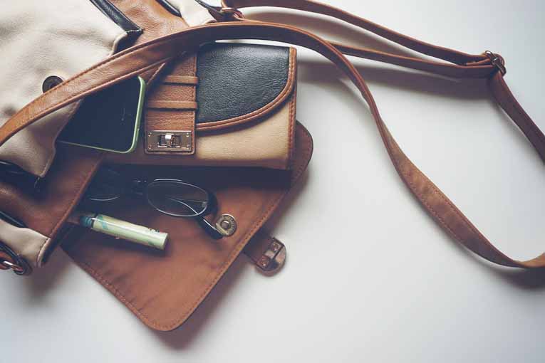 Leather bag full of travel accessories