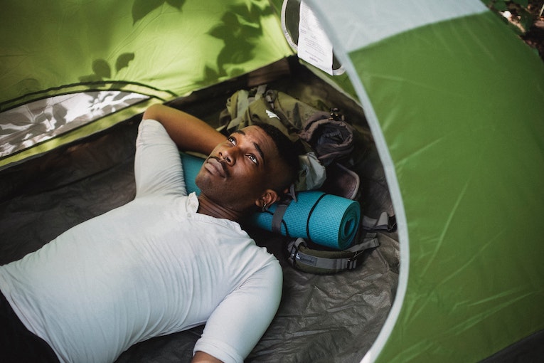 a solo travel spending time in their tent
