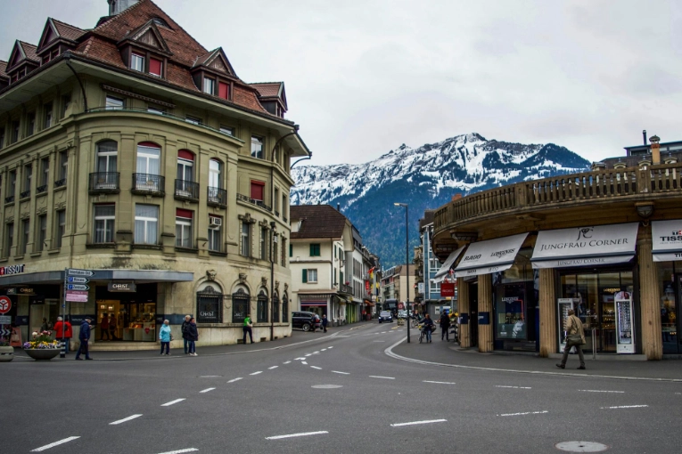 city intersection with mountains in the background