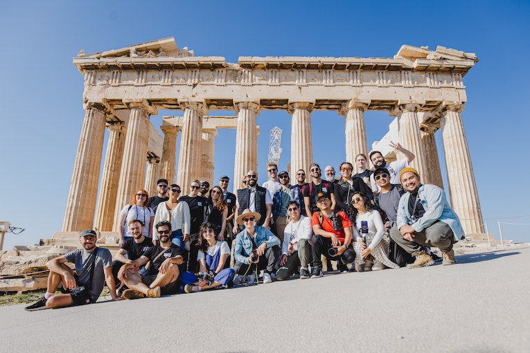 group of study abroad students standing in front of the parthenon